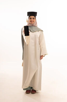 A black screen display, gestures of happiness at reaching the dream, success, excellence, and graduating from university, celebrating the completion of university studies, looking at the camera with gestures of pride, a portrait of a Saudi Gulf Arab female graduate wearing graduation attire and cap, holding a mobile phone, white background.
