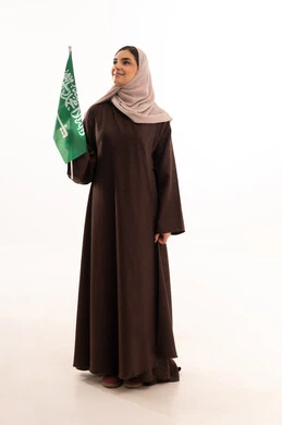 Raising the banner of monotheism and Islam, celebrating national occasions, pride and honor in belonging to the homeland, commemorating Saudi National Day on September 23, Flag Day on March 11, a portrait of a Saudi Arabian Gulf woman in a hijab holding the Saudi flag in her hand, full body length, white background. Raising the banner of monotheism and Islam, celebrating national occasions, pride and honor in belonging to the homeland, commemorating Saudi National Day on September 23, Flag Day on March 11, a portrait of a Saudi Arabian Gulf woman in a hijab holding the Saudi flag in her hand, full body length, white background.