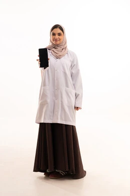 A black screen displayed on a mobile phone, providing therapeutic services in medical centers and hospitals, the concept of medicine and healthcare, a portrait of a Saudi Gulf Arab female doctor wearing a colorful abaya with a medical coat, recording and documenting patient information, full-body image, white background.