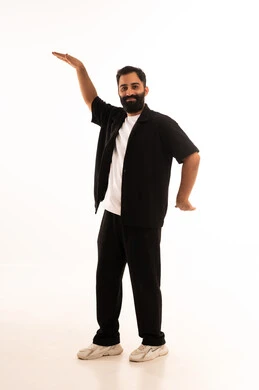 Gestures of joy and singing, humming to the tunes of songs, a portrait of an Arab Gulf Omani man wearing casual attire showing signs of happiness and joy, smiling and immersing himself in the atmosphere of music, gesturing with both hands in gestures of dance and joy, with a white background.