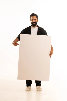 Advertisements and marketing offers, gestures of happiness and joy, use of illustrative boards and educational tools, a portrait of a smiling Omani Gulf Arab man wearing casual attire holding a white board (empty mock-up) in his hand, full body length, white background.