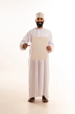 Gestures of happiness and joy, advertisements and marketing offers, use of illustrative boards and educational tools, a portrait of a smiling Omani Gulf Arab man wearing a dishdasha and a kumma holding a blank white board (empty mock-up), full body length, white background.