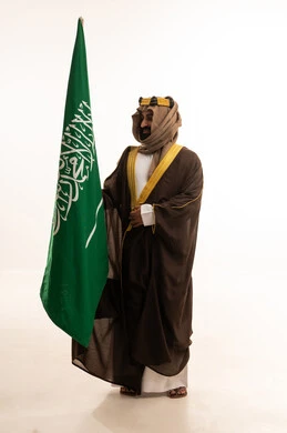 Commemoration of the Saudi National Day on September 23, the anniversary of the establishment of the first Saudi state on February 22, the day we began in 1727, a portrait of an Arab Saudi Gulf man wearing a bisht, ghutrah, and igal on the founding day raising the Saudi flag, Flag Day on March 11, white background. Commemoration of the Saudi National Day on September 23, the anniversary of the establishment of the first Saudi state on February 22, the day we began in 1727, a portrait of an Arab Saudi Gulf man wearing a bisht, ghutrah, and igal on the founding day raising the Saudi flag, Flag Day on March 11, white background.