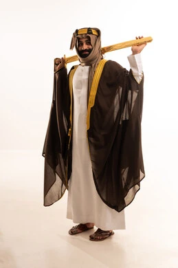 A portrait of a Saudi Arabian Gulf man wearing a bisht, ghutrah, and agal on Foundation Day, holding a sword in his hand, commemorating the establishment of the first Saudi state on February 22, a reminder of Saudi National Day on September 23, the day we began in 1727 AD.