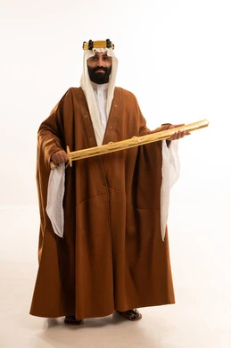 The anniversary of the establishment of the first Saudi state is on February 22, the commemoration of Saudi National Day is on September 23, a portrait of an Arab Saudi Gulf man wearing a bisht, ghutrah, and agal on the founding day holding a sword in his hand, the day we began 1727 AD.