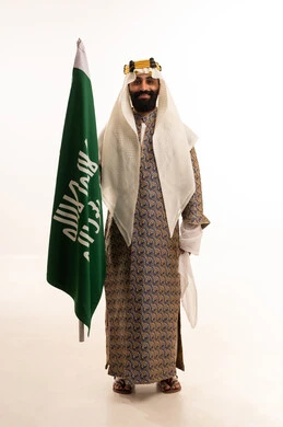 A portrait of an Arab Saudi Gulf man wearing a bisht, ghutrah, and agal on Founding Day, raising the Saudi flag. Flag Day is on March 11, the anniversary of the establishment of the first Saudi state on February 22, the day we began in 1727, a reminder of Saudi National Day on September 23, with a white background. A portrait of an Arab Saudi Gulf man wearing a bisht, ghutrah, and agal on Founding Day, raising the Saudi flag. Flag Day is on March 11, the anniversary of the establishment of the first Saudi state on February 22, the day we began in 1727, a reminder of Saudi National Day on September 23, with a white background.