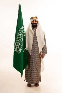 A portrait of a Saudi Arabian Gulf man wearing a bisht, ghutrah, and agal on Founding Day, raising the Saudi flag, commemorating the establishment of the first Saudi state on February 22, the day we began in 1727, the remembrance of Saudi National Day on September 23, Flag Day on March 11, with a white background. A portrait of a Saudi Arabian Gulf man wearing a bisht, ghutrah, and agal on Founding Day, raising the Saudi flag, commemorating the establishment of the first Saudi state on February 22, the day we began in 1727, the remembrance of Saudi National Day on September 23, Flag Day on March 11, with a white background.