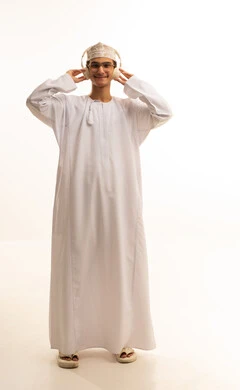 Interacting with musical melodies using headphones, gestures of immersion with the song, a portrait of an Arab Gulf Omani man wearing a dishdasha and kumma and glasses, listening to music through headphones with expressions of listening and enjoyment, artistic singing talent, full-body, white background.