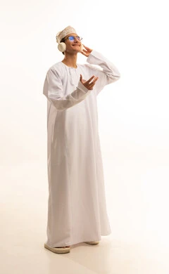 Interacting with musical melodies using headphones, gestures of immersion with the song, a portrait of an Arab Gulf Omani man wearing a dishdasha and kumma and glasses, listening to music through headphones with expressions of listening and enjoyment, artistic singing talent, full-body, white background.