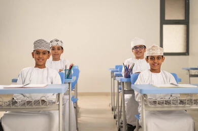 Back to school, preparing for the new academic year, education in the Sultanate of Oman, completing school assignments, a group of Arab Gulf Saudi students sitting in their seats.