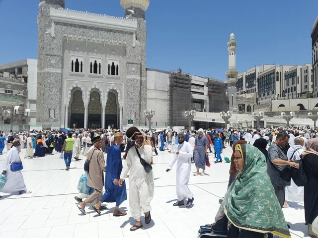 Visitors to the House of God in the streets surrounding the Grand Mosque in Mecca, sacred Islamic religious sites in the Kingdom of Saudi Arabia, performing the rituals of Hajj and Umrah, pilgrims and Umrah performers wandering in the streets.