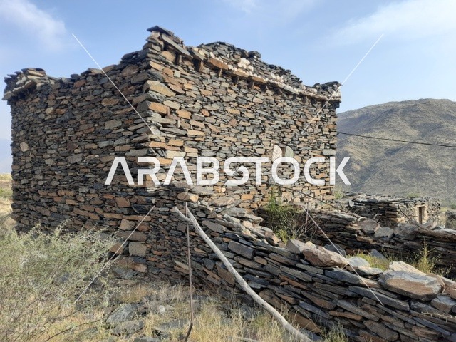 A heritage house in the Al-Baha region, the architectural geometric art in the old style of houses, tourist attractions in Saudi Arabia, historical forts and castles, constructed stone buildings and facilities, famous cultural heritage landmarks and places.