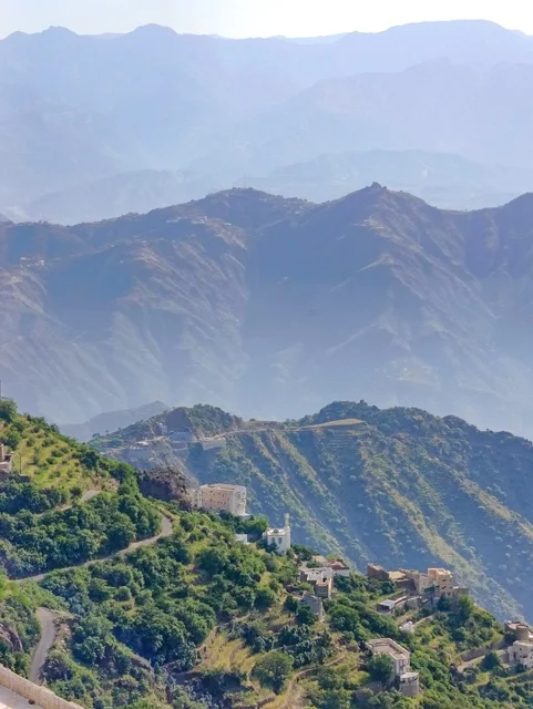 A place and natural tourist area, the landscapes of nature in the province of Faifa in the Jazan region in the south of the Kingdom of Saudi Arabia, the old houses and buildings, the green agricultural terraces, and the trees on the peaks and mountain heights, a natural backdrop.