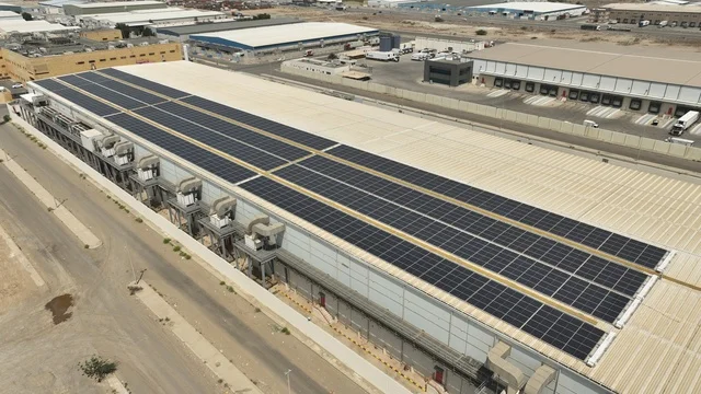 Development of infrastructure for electricity generation, renewable solar energy stations, the concept of producing environmentally friendly alternative energy in the Kingdom of Saudi Arabia, aerial drone photography of photovoltaic panels.