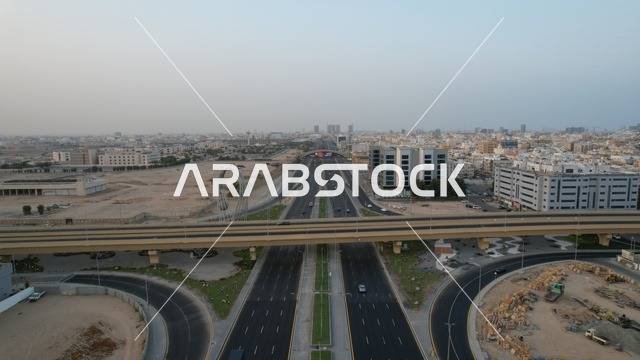 Aerial drone footage of the Sixty intersection, traffic of cars on public roads.