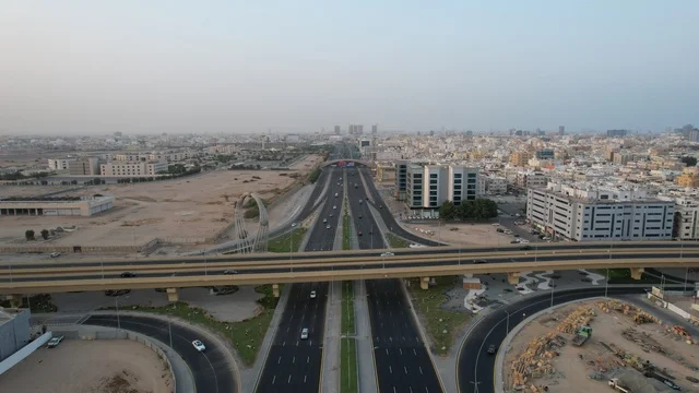 Aerial drone footage of the Sixty intersection, traffic of cars on public roads.