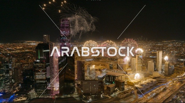 The architectural engineering art of towers and skyscrapers illuminated at night, the celebration of fireworks and firecrackers, famous tourist attractions, events and recreational activities, holidays and occasions in the Kingdom of Saudi Arabia.