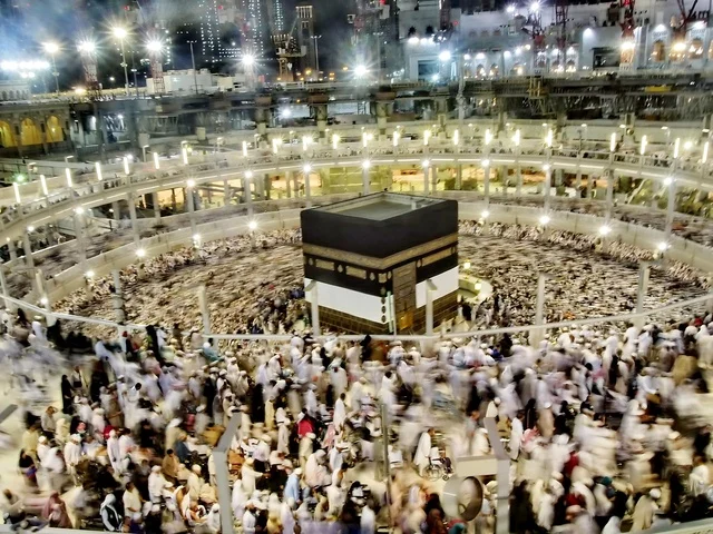 The Qibla of Islam and Muslims, drawing closer to God and worship, the Sacred House of God in the Holy Mosque in Mecca, Saudi Arabia, places and sacred Islamic landmarks, a close-up image of the Tawaf of pilgrims and Umrah performers in the expansion around the Holy Kaaba in Mecca, performing the rituals of Hajj and Umrah.