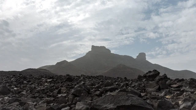 Mount Al-Fahlatin is located northwest of Medina, the desert areas in Taif in the Kingdom of Saudi Arabia, the natural mountain peaks and highlands, the mountains of Wadi Disa, the mountainous nature in black, tourist places in Saudi Arabia.