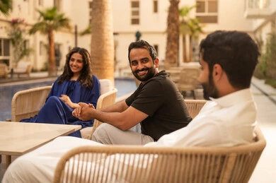 Visits to family and relatives, spending enjoyable family time outdoors, recreational resorts and chalets in the Kingdom, a Saudi Gulf Arab family enjoying time in one of the tourist chalets, family entertainment activities, a fun summer vacation.