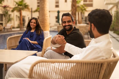 Visits to family and relatives, spending enjoyable family time outdoors, recreational resorts and chalets in the Kingdom, a Saudi Gulf Arab family enjoying time in one of the tourist chalets, family entertainment activities, a fun summer vacation.