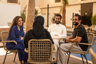 Visits to family and relatives, spending enjoyable family time outdoors, recreational resorts and chalets in the Kingdom, a Saudi Gulf Arab family enjoying time in one of the tourist chalets, family entertainment activities, a fun summer vacation.