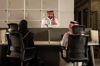 Arab Saudi Gulf colleagues are using laptops, designated spaces for each employee in the company, focus and meticulous work, dialogues and discussions within the team, business and company development, work meetings and project completion, discussing plans and explaining work tasks. Arab Saudi Gulf colleagues are using laptops, designated spaces for each employee in the company, focus and meticulous work, dialogues and discussions within the team, business and company development, work meetings and project completion, discussing plans and explaining work tasks.