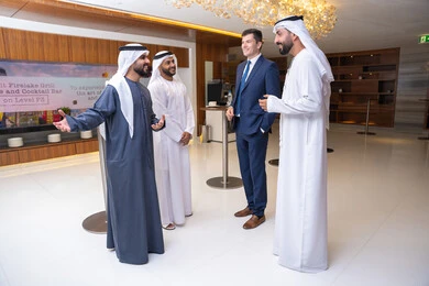 Elegance and appearance, discussion and understanding among employees, collaboration in achieving tasks, strategic plans to achieve goals, holding a meeting within the company, professions and office jobs, a group of Arab Gulf businessmen from the UAE discussing work methods and professional development with a foreign businesswoman.