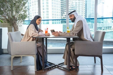 مناقشة الاعمال وتبادل الافكار، توثيق اللحظات السعيدة ، التقاط الصور التذكارية عبر الجوال ، قضاء اوقات ممتعة مع الأصدقاء، بناء وتعزيز العلاقات والصداقات،اجتماع عمل في مكان خارج مقر الشركة, زميلان عمل عربيان خليجيان إماراتيان يجلسان على طاولة في أحد المطاعم الراقية في الإمارات احداهما يستخدم الهاتف المحمول مناقشة الاعمال وتبادل الافكار، توثيق اللحظات السعيدة ، التقاط الصور التذكارية عبر الجوال ، قضاء اوقات ممتعة مع الأصدقاء، بناء وتعزيز العلاقات والصداقات،اجتماع عمل في مكان خارج مقر الشركة, زميلان عمل عربيان خليجيان إماراتيان يجلسان على طاولة في أحد المطاعم الراقية في الإمارات احداهما يستخدم الهاتف المحمول