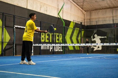A youth recreational and sports activity, the Saudi Tennis Federation, two Arab Gulf Saudi young men practicing tennis and playing racquet sports in public courts, the concept of fitness and agility, sports games and training.