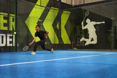 Sport and recreational activity, playing tennis in public courts, a young Arab Gulf Saudi man wearing sportswear practicing lawn tennis, the concept of fitness and agility, the Saudi Tennis Federation.
