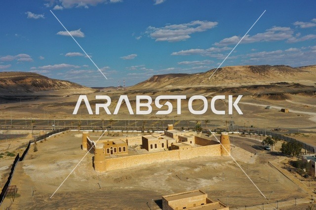 The building made of stones, a historical fortress and castle, famous tourist attractions in the Kingdom of Saudi Arabia, the mountainous heights in Al-Baha in Mecca, the mountainous nature and rock formations, places that attract and draw people from all over the world, the clear blue sky.