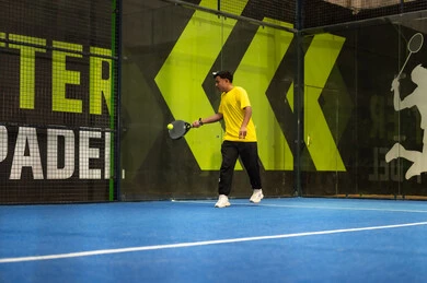 A sport and youth hobby, playing tennis in public courts, a young Arab Gulf Saudi man wearing sportswear practicing lawn tennis, the concept of fitness and agility, the Saudi Tennis Federation.
