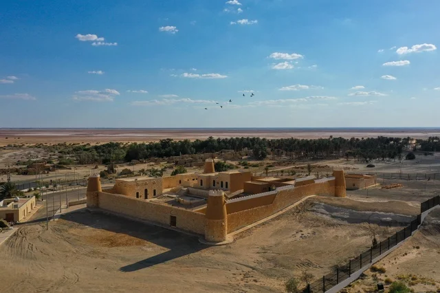 The mountainous nature and rock formations, the clear blue sky, the stone buildings, a historical fortress and castle, famous tourist attractions in the Kingdom of Saudi Arabia, the mountainous heights in Al-Baha in Mecca, places that attract and draw people from all over the world.