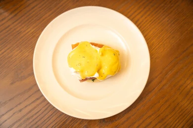 A breakfast meal, delicious food full of healthy proteins, diet meals, a useful and healthy dish, pieces of toast and slices of cold cuts with fried eggs.