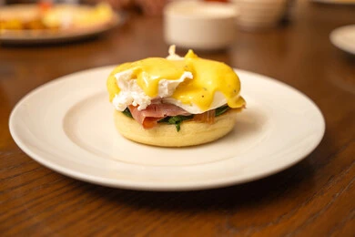 A breakfast meal, delicious food full of healthy proteins, diet meals, a useful and healthy dish, pieces of toast and slices of cold cuts with fried eggs.