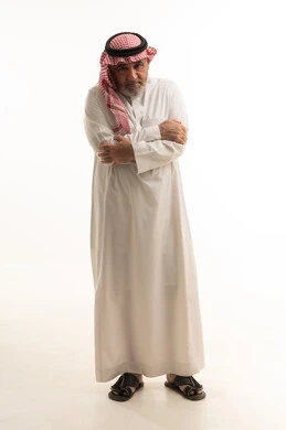 The feeling of fatigue and exhaustion, gestures of pain in the shoulders, inflammation of the muscles and joints, a portrait of an elderly Arab Saudi Gulf man wearing traditional attire, placing his hand on his neck with expressions of pain, the need to create a treatment plan, requesting help to go to the hospital, full-body, white background.