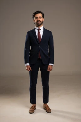 Gestures of self-confidence, taking a personal photo for official documents, the concept of elegance and masculinity, a portrait of an Arab Gulf Saudi businessman wearing a formal suit looking at the camera with expressions of joy and happiness, attention to external appearance, white background.