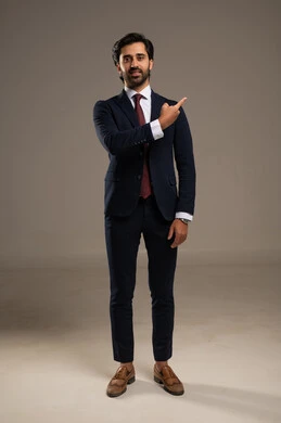 Pointing with the index finger at something, gestures and expressions of joy and happiness, the concept of elegance and masculinity, a portrait of an Arab Gulf Saudi businessman wearing a formal suit, attention to external appearance, full-body, white background. Pointing with the index finger at something, gestures and expressions of joy and happiness, the concept of elegance and masculinity, a portrait of an Arab Gulf Saudi businessman wearing a formal suit, attention to external appearance, full-body, white background.