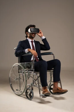 Spending enjoyable and entertaining times with virtual games, integrating advanced technology into daily life, enjoying watching virtual reality movies, a portrait of an Arab Gulf Saudi man wearing a formal suit sitting in a wheelchair and wearing 3D virtual reality glasses, white background.