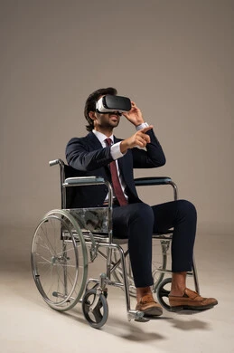 Integration and simulation of the imaginary world, merging advanced technology into daily life, spending enjoyable and entertaining times with virtual games, a portrait of an Arab Gulf Saudi man wearing a formal suit sitting in a wheelchair and wearing 3D virtual reality glasses, white background.