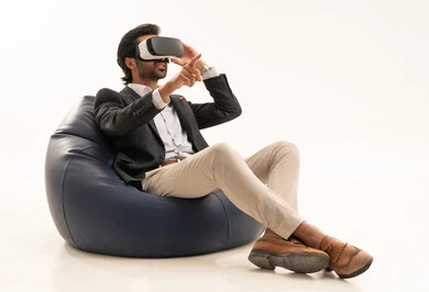 Simulation of the imaginary world, a young Saudi man pointing to a place with expressions of immersion and simulation of the imaginary world, attempting to click on something, a portrait of an Arab Gulf Saudi man wearing a formal suit sitting on a comfortable chair wearing 3D glasses raising his index finger upwards, white background. Simulation of the imaginary world, a young Saudi man pointing to a place with expressions of immersion and simulation of the imaginary world, attempting to click on something, a portrait of an Arab Gulf Saudi man wearing a formal suit sitting on a comfortable chair wearing 3D glasses raising his index finger upwards, white background.