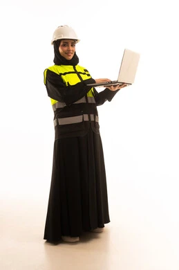 Engineering project management, completing work tasks via a laptop, a portrait of a Gulf Arab Saudi engineer wearing a jacket and safety helmet holding a laptop, working in the engineering sector, a young Saudi woman studying the fundamentals of the project, full-body image, white background.