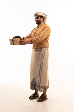 The concept of gratitude and appreciation, giving gifts on holidays and special occasions, expressing love, respect, and admiration, a portrait of an Arab Yemeni man wearing a shirt and a sarong with a turban holding a gift box in his hands, looking with gestures of happiness and joy, full-body, white background.
