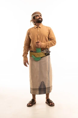 Expressions of cheerfulness and joy, maintaining traditional dress, representing authentic Arab masculinity, looking at something above with gestures of self-confidence, a portrait of a Yemeni Arab man wearing a shirt and izar with a turban and a jambiya standing upright, full body length, white background.