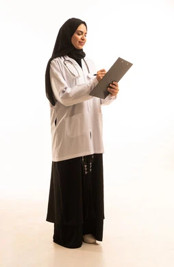 A side portrait of an Arab Gulf Saudi female doctor wearing a white coat and stethoscope, holding a notebook with general information about the patient's condition, providing service and medical consultation, women's professions and jobs, studying and reviewing patient cases, full-body, white background.