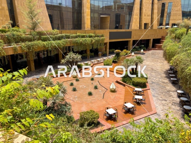 Modern architectural design, the modern commercial district in the capital, the Lisen Valley neighborhood in Riyadh, a contemporary and upscale destination, offices of global companies and commercial and entertainment facilities, stylish restaurants and cafes, open event areas, and green spaces for walking and relaxation.