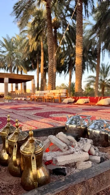 A daytime outdoor camping trip for young people, spending enjoyable time with family and friends in central Saudi Arabia, visiting tourist destinations, enjoying traditional recreational activities, and experiencing local heritage and culture.