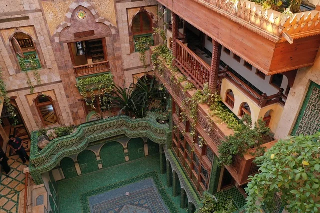 Embodiment of the atmosphere of the courtyards of ancient heritage houses in the Kingdom of Saudi Arabia, the concept of tranquility and relaxation, details of gypsum decoration in home decor, simple life in historical homes, love for the old traditional style, enjoying the distinctive natural views.