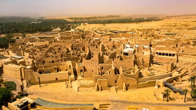 Attracting and drawing tourists from around the world, the archaeological buildings and mud houses in the Al-Turaif neighborhood in Old Diriyah, a drone image of famous historical archaeological landmarks in Riyadh, the establishment of the first Saudi state in 1727 AD, architectural engineering art in the old style, a heritage tourist destination in Saudi Arabia. Attracting and drawing tourists from around the world, the archaeological buildings and mud houses in the Al-Turaif neighborhood in Old Diriyah, a drone image of famous historical archaeological landmarks in Riyadh, the establishment of the first Saudi state in 1727 AD, architectural engineering art in the old style, a heritage tourist destination in Saudi Arabia.
